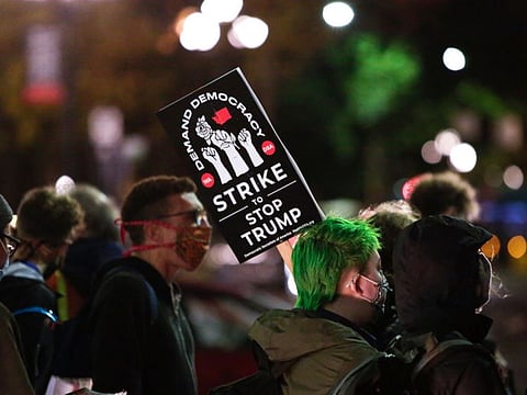 Americans participate in a march to "Count Every Vote, Protect Every Person" on the day after the US Presidential Election in Seattle, Washington on November 4, 2020
