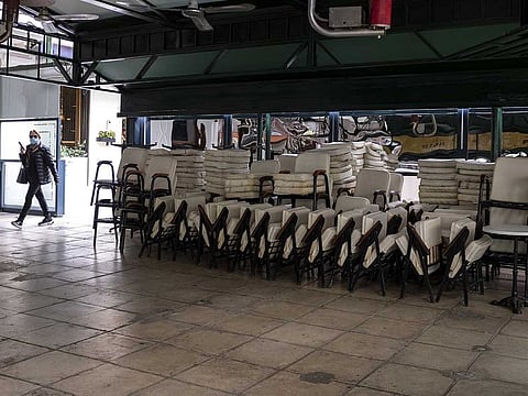 Restaurant chairs and tables removed from customer use under new COVID-19 rules outside a coffee shop in Athens, Greece, on Tuesday, Nov. 3, 2020.