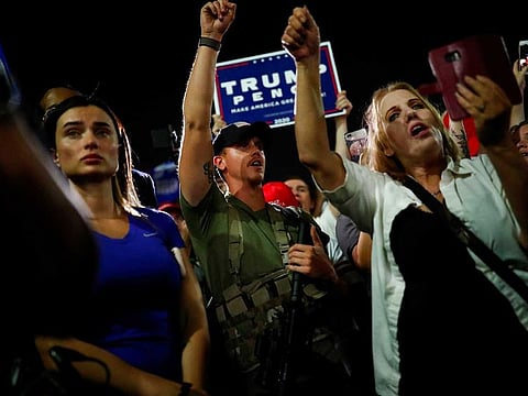 Supporters of US President Donald Trump gather in front of the Maricopa County Tabulation and Election Center (MCTEC) to protest about the early results of the 2020 presidential election, in Phoenix, Arizona November 4, 2020.