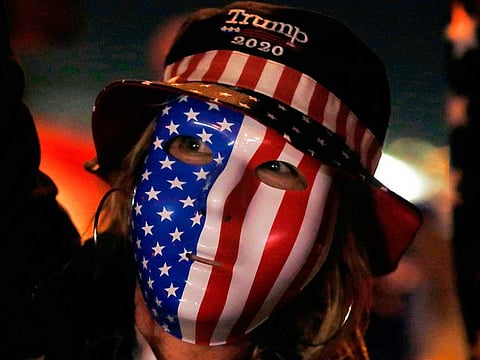Donald Trump supporter Wetonia Houlihan wears a mask and joins others in protesting the Nevada vote outside Clark County Election Department on November 5, 2020, in North Las Vegas.