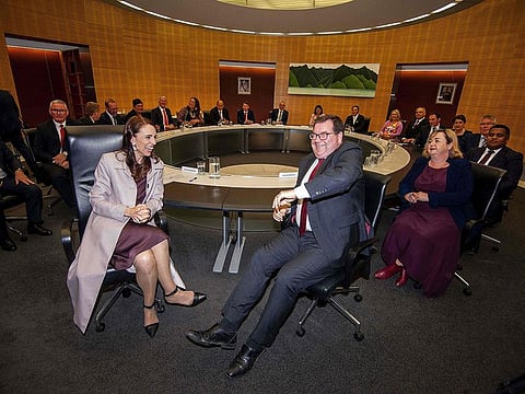 New Zealand Prime Minister Jacinda Ardern (L) and Deputy Prime Minister Grant Robertson (R) attend a cabinet meeting at the parliament in Wellington on November 6, 2020.