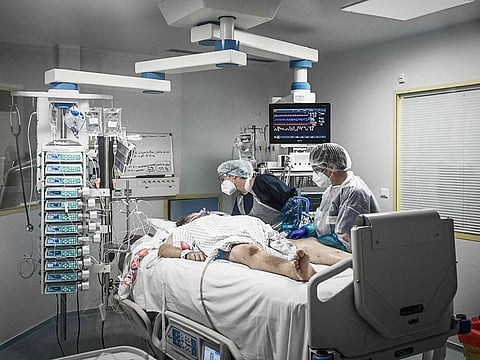 For illustrative purposes only: Medical personnel attend a COVID-19 patient at the reanimation section of the Robert Boulin hospital in Libourne, southwestern France.