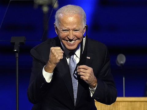 President-elect Joe Biden gestures to supporters Saturday, Nov. 7, 2020, in Wilmington, Del