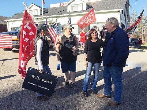 Supporters of the US president who still refuse to recognise Joe Biden's victory, including local Republican Candidate Doug McLinko (R), gather outside Jones Diner in Towanda, Pennsylvania on November 8, 2020.