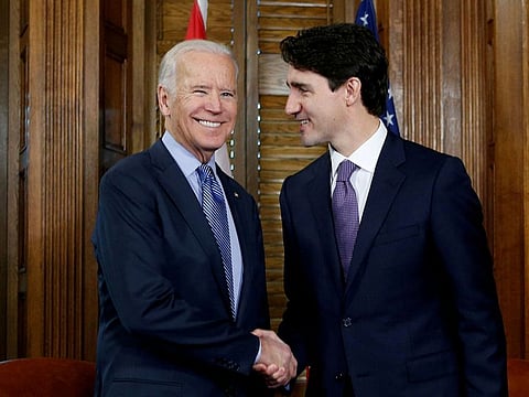 FILE PHOTO: Canada's Prime Minister Justin Trudeau (R) shakes hands with U.S. Vice President Joe Biden.