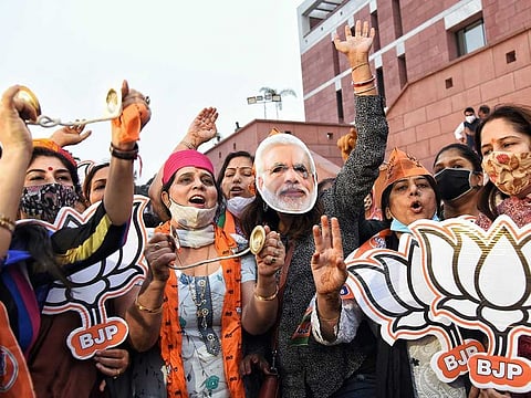 BJP supporters celebrate the party's good performance in the Bihar elections at the BJP headquarters in New Delhi on Tuesday, November 10, 2020.