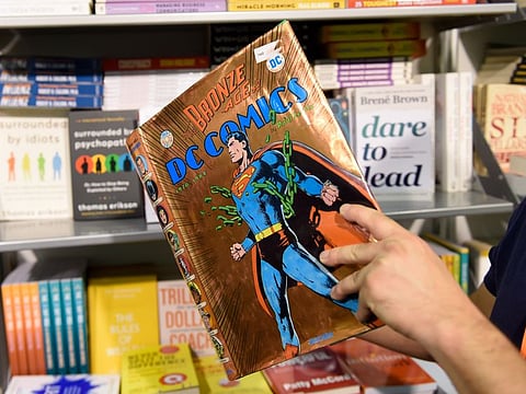 A visitor looking at one of the few comics available at the 39th Sharjah International Book Fair 2020. Photo: Virendra Saklani/Gulf News