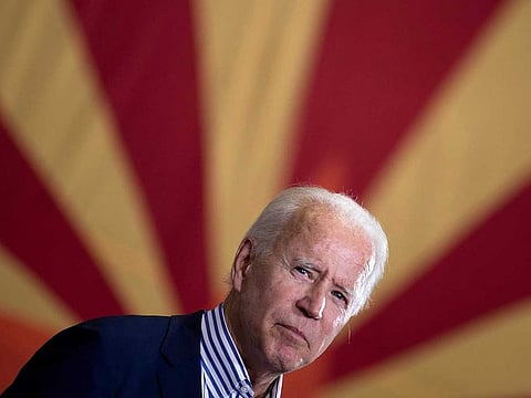 Joe Biden pauses while speaking to supporters in Phoenix, Arizona.