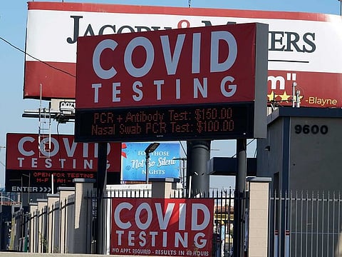 Advertisements for COVID-19 testing are posted outside Los Angeles International Airport in Los Angeles, Friday, Nov. 13, 2020. California has become the second state to record 1 million confirmed coronavirus infections.
