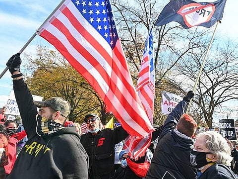 Demonstrators square off at Black Lives Matter Plaza on November 13, 2020. Writer and journalist Frederick Douglass identified and fought racism in American society.
