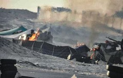 A handout picture published by the Royal Moroccan Army Facebook page on November 13, 2020, shows tents used by the Polisario Front ablaze near the Mauritanian border in Guerguerat located in the Western Sahara, along the road leading to Mauritania, after the intervention of the royal Moroccan armed forces.