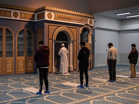 Muslim worshippers pray in the first official mosque in the Greek capital Athens, a day after its opening on November 3, 2020.