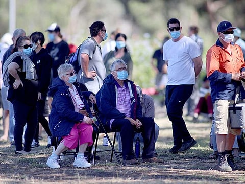People are seen queuing at a coronavirus disease (COVID-19) testing site as the state of South Australia experiences an outbreak, in Adelaide, Australia, November 17, 2020.