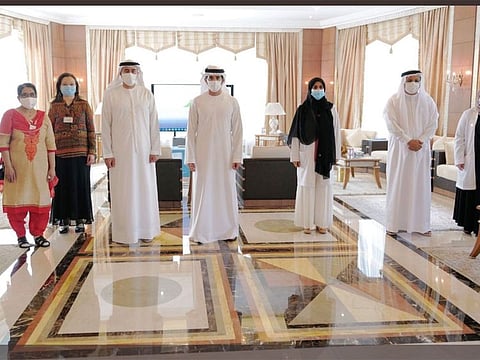 Shaikh Hamdan bin Mohammad bin Rashid Al Maktoum, the Crown Prince of Dubai and Chairman of the Dubai Executive Council, with the Dubai Health Authority (DHA) team.