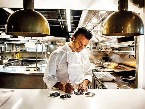 Sash Simpson at work in the kitchen of his Toronto restaurant, Sash, on Oct. 28, 2020. The past eight months, Simpson has borrowed money to cover the payroll of a bare-bones staff, even after government cheques and rent subsidies were collected.