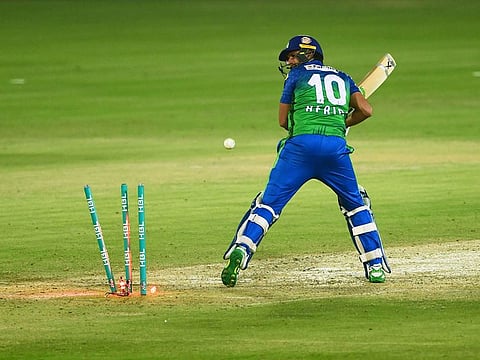 Multan Sultans' Shahid Afridi is bowled out by Lahore Qalandars Haris Rauf (unseen) during the PSL match between them at the National Stadium in Karachi on November 15, 2020.