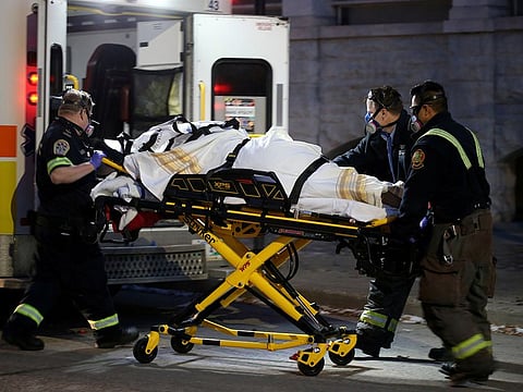 Paramedics wear respirators while responding to a medical call, amid the outbreak of the coronavirus disease (COVID-19), in downtown Winnipeg, Manitoba