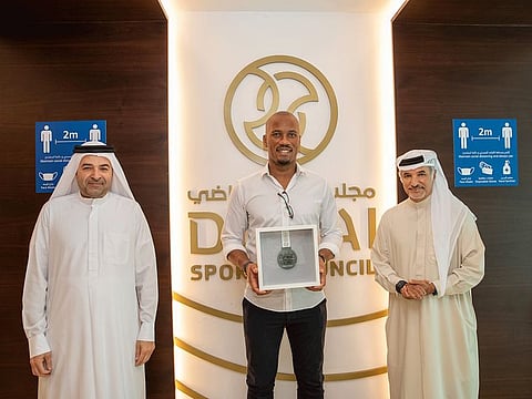 Didier Drogba (centre) is flanked by Saeed Al Hareb (right) and Nasser Aman Al Rahma during his visit to Dubai Sports Council office.