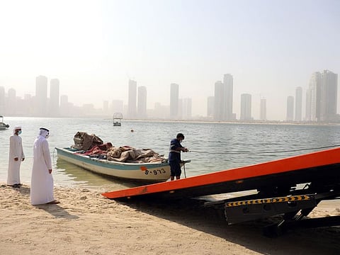 An abandoned boat being removed