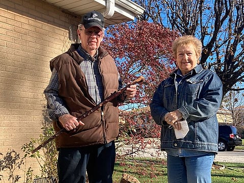 Dan Donovan, joined by his wife, Barbara, holds the antique shillelagh he used to chase burglars from the couple's Niles home even hitting one of the men in the back of the head.