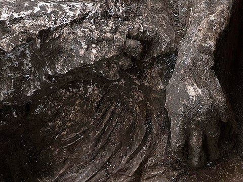 A detail of a cast of one of the bodies of two men, a 40-year-old master and his young slave, after they were found during recent excavations of a Villa in Civita Giuliana in the outskirts of Pompeii.