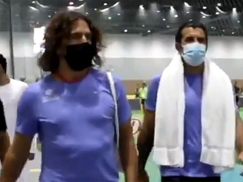 Carles Pyol and Luis Figo arrive for the match in Dubai