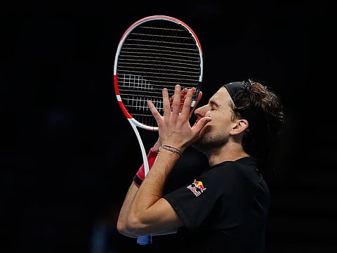 Dominic Thiem celebrates his win over Novak Djokovic in the ATP Finals