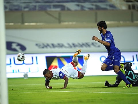 Sharjah Club's Welliton Soares (going down) struck for his team in a 2-0 away win over Khor Fakkan.