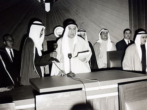 Abdullah Al Salem (centre) taking the constitutional oath at the opening of the first parliament in 1963.