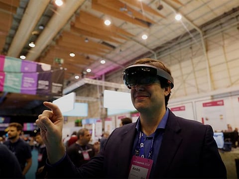 File photo: A visitor wears virtual reality glasses during the Websummit in Lisbon, Portugal.