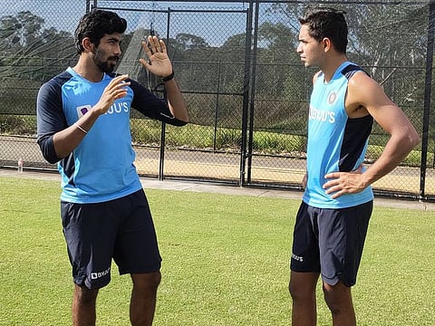 India's Jasprit Bumrah and Kartik Tyagi discuss the finer details during training ahead of the first ODI against Australia on Friday