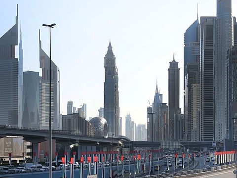UAE flags flutter in the wind on Sheikh Zayed Road in Dubai as the UAE prepares to celebrate its 49th National Day.