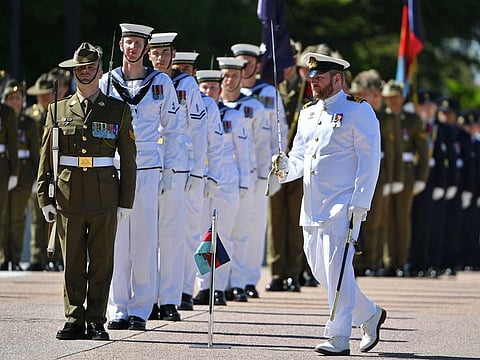 An honour guard is formed at Defence Headquarters in Canberra, Australia, Thursday, Nov. 19, 2020, before findings from the Inspector-General of the Australian Defence Force Afghanistan Inquiry are released. A shocking report into war crimes by elite Australian troops has found evidence that 25 soldiers unlawfully killed 39 Afghan prisoners, farmers and civilians.