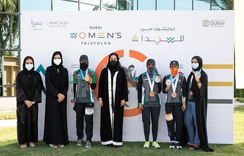 Mona Al Marri with dignitaries and participants of the Dubai Triathlon.