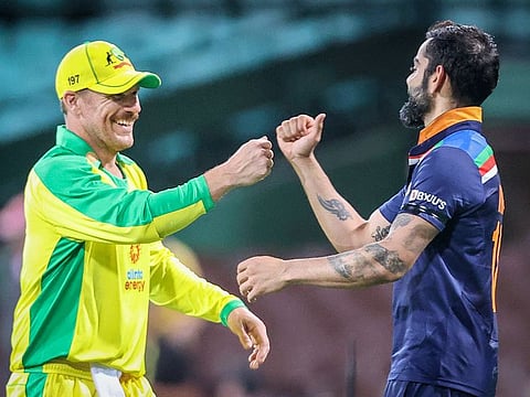 Australia captain Aaron Finch (left) bumps fists with his Indian counterpart Virat Kohli after their 66-run victory in the first One-day International at Sydney Cricket Ground on Friday.