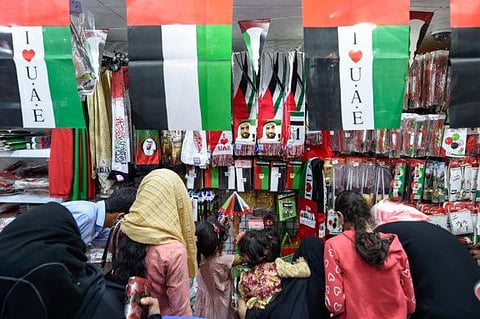 People buy national Flags and accessories at Al Sadiq discounts market in Sharjah,  Photo: Ahmed Ramzan/ Gulf News