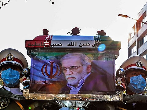 A handout picture provided by Iran's Defence Ministry on November 30, 2020 shows members of Iranian forces carrying the coffin of slain top nuclear scientist Mohsen Fakhrizadeh during his funeral ceremony in Iran's capital Tehran.
