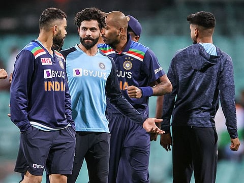 File photo: India's captain Virat Kohli (L) talks with team mates after their the one-day cricket match against Australia at the Sydney Cricket Ground (SCG) in Sydney on November 29, 2020.