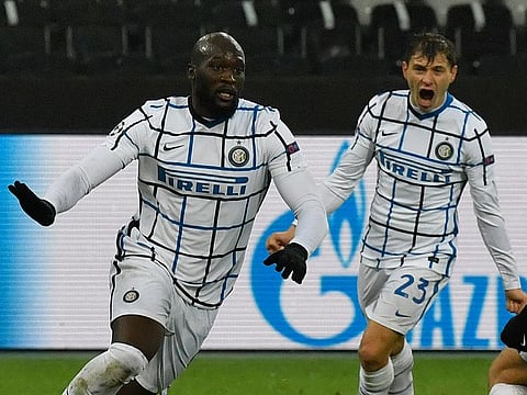 Inter Milan's Romelu Lukaku, left, celebrates after scoring his side's second goal.