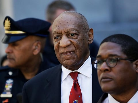 In this April 26, 2018 file photo, Bill Cosby, center, leaves the the Montgomery County Courthouse in Norristown, Pa., after being convicted of drugging and molesting a woman.