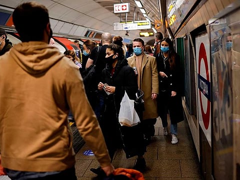 Passengers travel via a London Underground tube train during the morning rush hour in London in this file photo taken on December 2, 2020