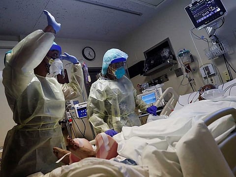File photo: Health care workers administer physical therapy to a coronavirus disease (COVID-19) positive patient at Roseland Community Hospital on the South Side of Chicago, Illinois, US, December 1, 2020.