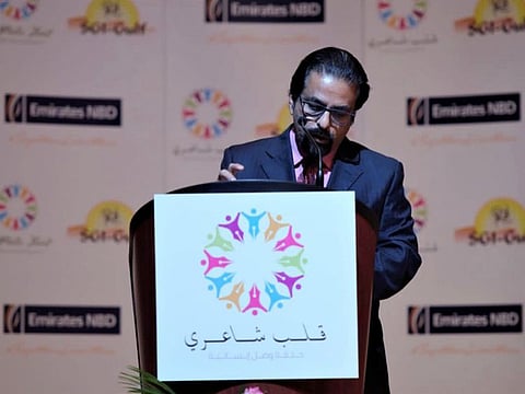 Ismail Meladi presenting an Arabic poem at the Poetic Heart event in Dubai in 2018.