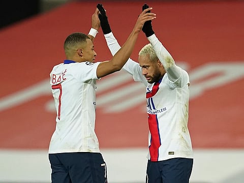 PSG's Neymar, right, celebrates with Kylian Mbappe after scoring his side's third goal.