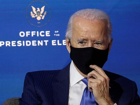 U.S. President-elect Joe Biden listens after announcing nominees and appointees to serve on his economic policy team at his transition headquarters in Wilmington, Delaware, U.S., December 1, 2020.