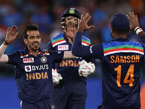 Yuzvendra Chahal (left) celebrates the fall of Steve Smith in the first T20 International in Canberra on Friday.