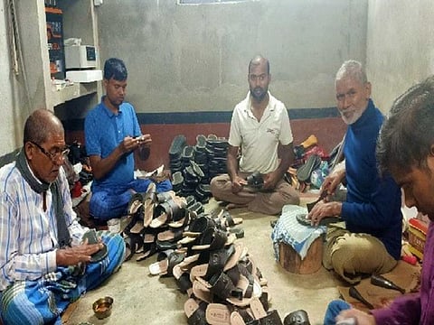 Migrant workers make medicated shoes at the units they set up on return to their villages in Bihar after losing jobs due to the COVID-19 lockdown in India.