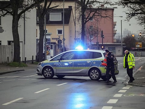 Police closes a street as people leave their home area in the Gallus district in Frankfurt am Main, western Germany, during an evacuation on early morning of December 6, 2020.