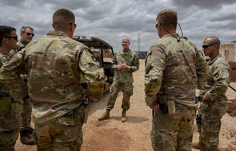 A photo provided by the Combined Joint Task Force - Horn of Africa shows Brig. Gen. Damian Donahoe, centre, with a group of fellow Army soldiers in Somalia, September 5, 2020.