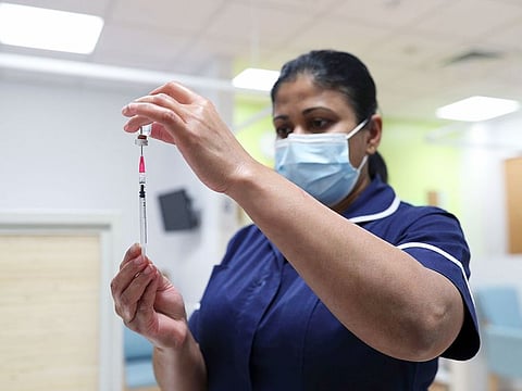 A nurse prepares the Pfizer vaccine.
